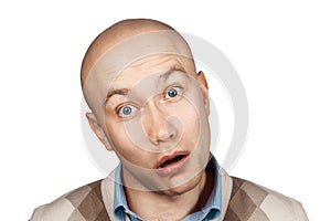 Portrait of a bald stupid surprised guy with open mouth on an isolated background