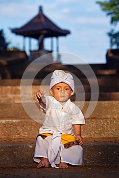 Portrait of balinese child in traditional costume - Sarong
