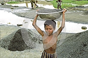 Portrait of Bangladeshi boy working in gravel pit