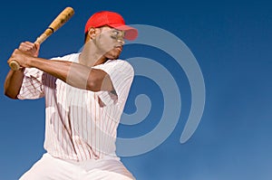 Portrait of Baseball Batter hitting the Ball