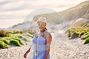 Portrait, beach or black woman on holiday to relax on vacation break in Greece at sunset in summer. Tourist, girl or