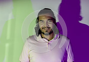 portrait bearded latino man with colored gels in studio