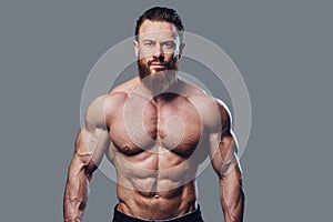 Portrait of bearded shirtless bodybuilder.