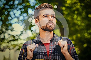 Portrait of bearded traveler male.