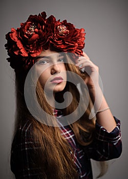 portrait of a beatiful girl with a wreath in studio