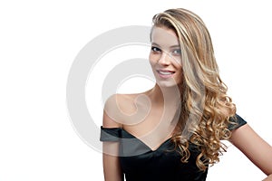 Portrait of a beatiful smiling girl with blonde hair on the white background