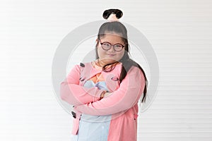 Portrait of beaufiful and cute teen Asian down syndrome girl posing as a model with fun and delight self-confidence