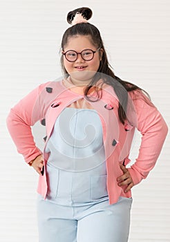 Portrait of beautiful and cute teen Asian down syndrome girl posing as a model