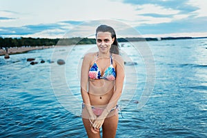 Portrait of beautiful active woman spending summer holidays on the beach, enjoying surfing, Bali, Indonesia