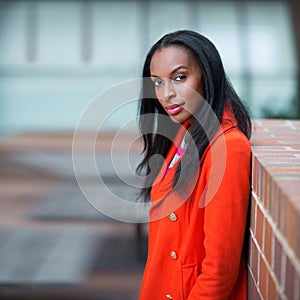 Portrait of beautiful african american confident woman standing outdoors of the office building.