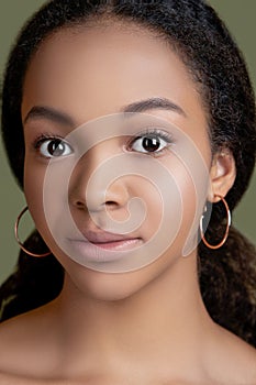 Portrait of beautiful african american female model smiling. Closeup beauty portrait. Clean skin.