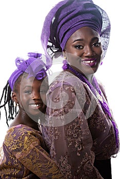 Portrait of beautiful African lady and little girl in traditiona dress.Isolated