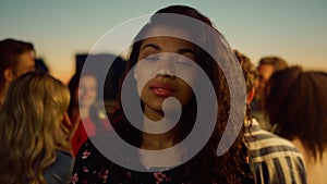 Portrait african woman posing camera at party. Afro girl smiling outdoors.