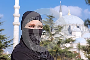 Portrait of beautiful Arabian Woman in traditional Muslim Clothing