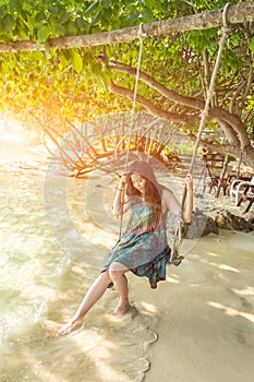 Portrait of beautiful Asia woman wearing long dress on the beach