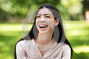 Portrait Of Beautiful Asian Girl Sincerely Laughing Outdoors, Enjoying Day In Park