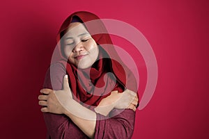 Muslim Woman Hug Her Self photo