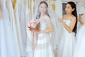 Portrait of beautiful asian woman bride funny together,Ceremony in wedding day,Happy and smiling