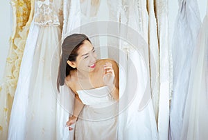 Portrait of beautiful asian woman bride in white dress cheerful and funny,Ceremony in wedding day,Happy and smiling