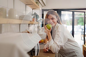 Portrait of Beautiful asian woman eating healthy food salad at kitchen room at house