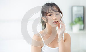 Portrait beautiful asian woman makeup of cosmetic, girl hand touch cheek and smile attractive