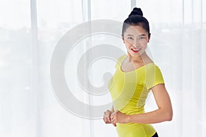 Portrait of Beautiful Asian woman is prepared to exercise yoga in the yoga room for good health and flexibility of the muscles