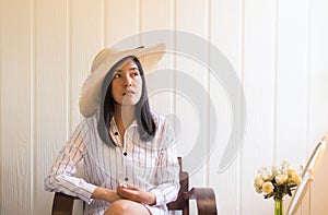 Portrait of beautiful asian woman relax and sitting near window at home,Positive thinking,Good attitude