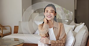 Portrait of beautiful Asian woman relaxing on comfortable couch