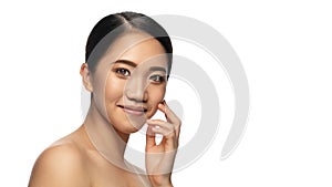 Portrait of beautiful asian woman  on white studio background. Beauty, fashion, skincare, cosmetics concept.