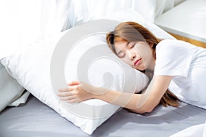 Portrait of beautiful asian young woman sleep lying in bed with head on pillow comfortable and happy with leisure.