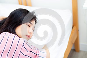 Portrait of beautiful asian young woman sleep lying in bed with head on pillow comfortable and happy with leisure, girl with relax