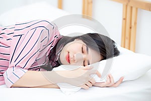 Portrait of beautiful asian young woman sleep lying in bed with head on pillow comfortable and happy with leisure.