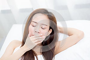 Portrait of beautiful asian young woman sleep lying in bed with head on pillow comfortable and yawn with leisure