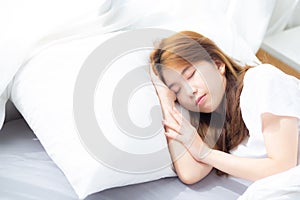 Portrait of beautiful asian young woman sleep lying in bed withPortrait of beautiful asian young woman sleep lying in bed with hea