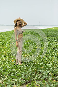 Portrait of beautiful asian younger woman standing on natural sea beach