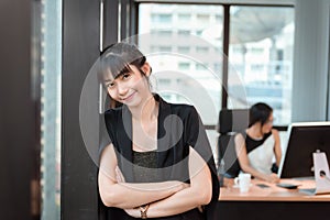 Portrait of Beautiful Attractive Business Woman Standing Beside Windows Frame in Modern Office, Confident Asian Girl in Arms