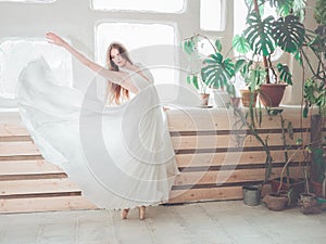 Portrait  of beautiful  balerina woman weared in white dress