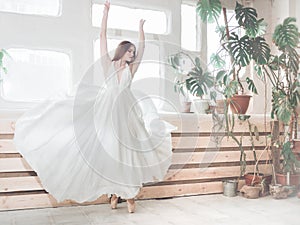 Portrait  of beautiful  balerina woman weared in white dress