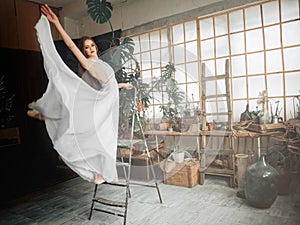 Portrait  of beautiful  balerina woman weared in white dress photo