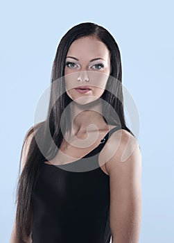 Portrait of beautiful black-haired woman posing on white backgro
