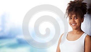 Portrait of beautiful black woman. Atractive brunette dark-skinned woman in a white tank top.