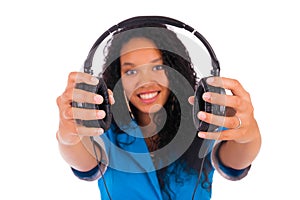 Portrait of a beautiful black woman with headphones listening to