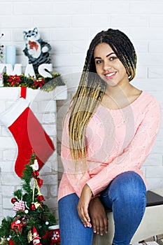 Portrait of Beautiful black Woman in Lights. Fashion Dress and MakeUp. Christmas Santa. Elegant Lady in Red Dress over Christmas
