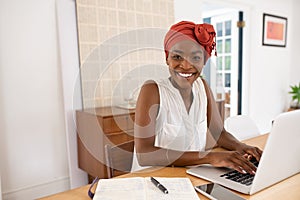 Portrait of beautiful black woman working from home