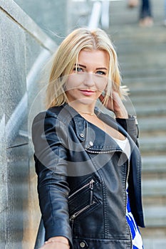 Portrait of a beautiful blonde in blue skirt