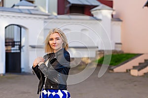 Portrait of a beautiful blonde in blue skirt