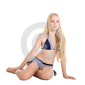 Portrait of a beautiful blonde European girl wearing swimming suit.