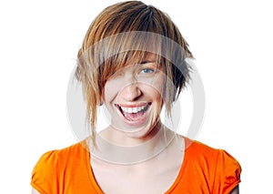 Portrait of a beautiful blonde female laughing