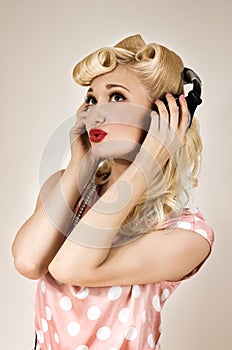 Portrait of beautiful blonde girl listening to music