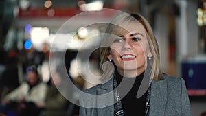 Portrait of a beautiful blonde girl with red lips